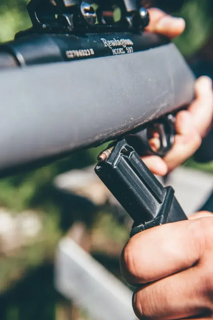 A person holding a rifle in South Dakota.